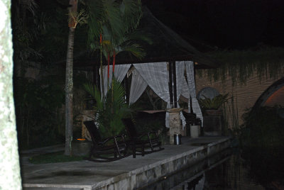 Bale by pool  at night