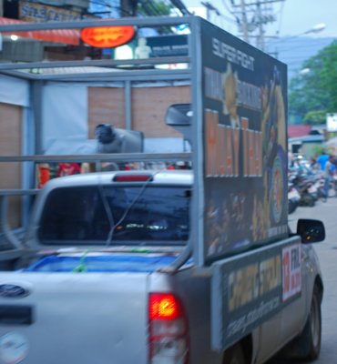 Before Muah Thai fight nights, roving trucks blast advertising by loudspeaker