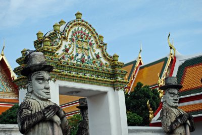 Top-hatted guardians at Wat Pho,  temple of the Reclining Buddha