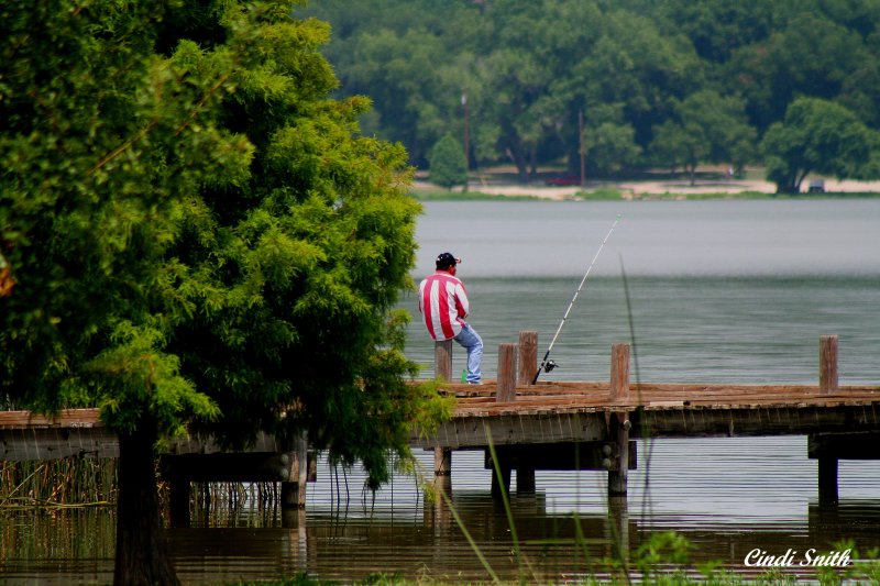 SITTING ON THE DOCK OF THE LAKE....WASTING TIME