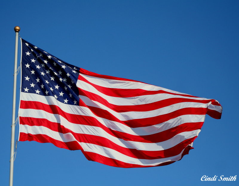 OLD GLORY FLYING ON A BEAUTIFUL SUMMER DAY