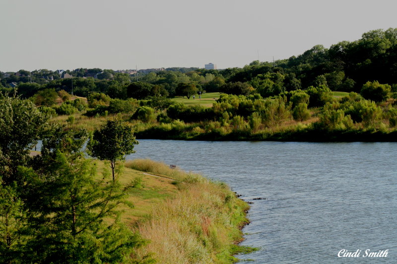 VIEW OF THE GOLFCOURSE FROM THE OTHER SIDE OF THE LAKE