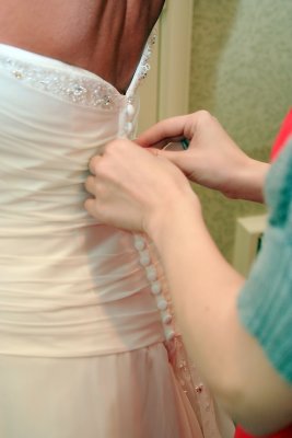 BUTTONING THE DRESS