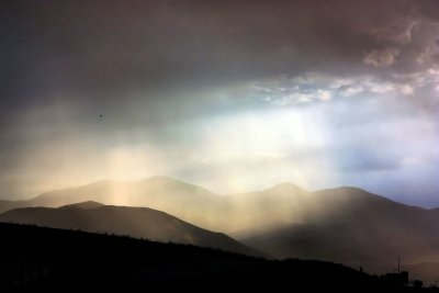 AS THE SUN POKES THROUGH AFTER A RAIN SHOWER