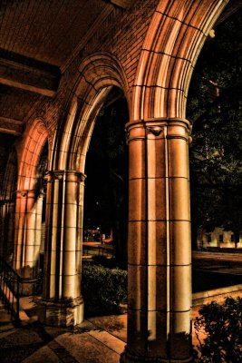 LIGHT REFLECTING ON ARCHES AT NIGHT