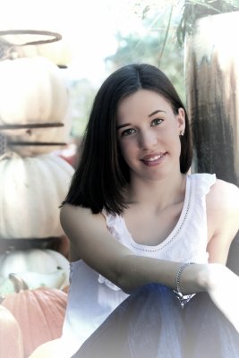 SITTING AMONG THE PUMPKINS