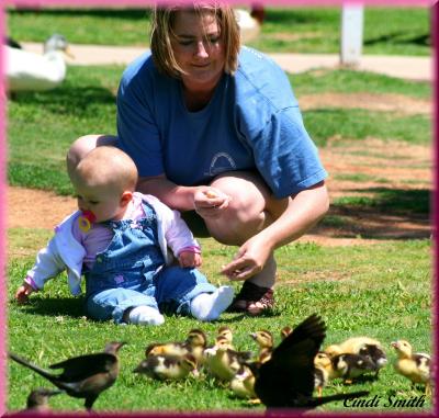 LITTLE BABY GIRL WITH THE LITTLE BABY DUCKS