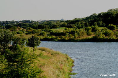 VIEW OF THE GOLFCOURSE FROM THE OTHER SIDE OF THE LAKE