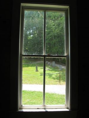 looking out the window toward the cemetery