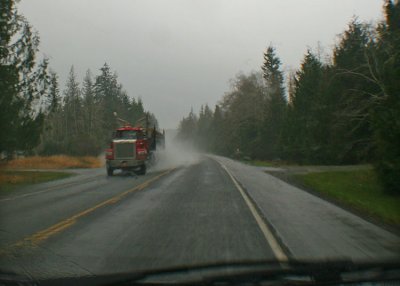 log truck, wet road