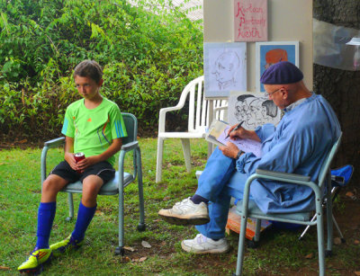 Kartoon Portrait Artist and His Subject