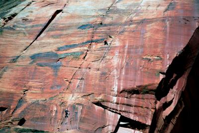 Climbers on red rock face slanted.jpg