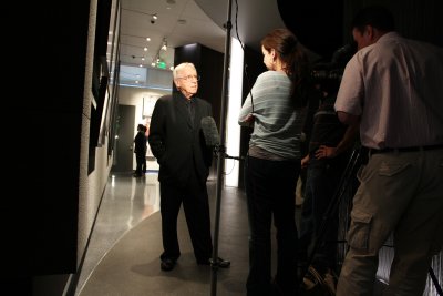 ABC-TV news team interviewing featured photographer Melvin Sokolsky