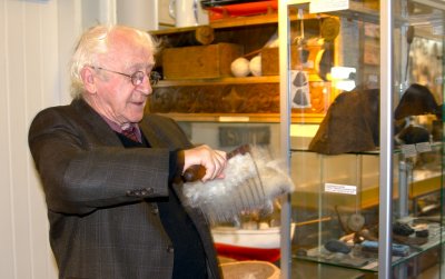Portur Tomasson, creator of the Skogar Folk Museum (1959), carding wool.