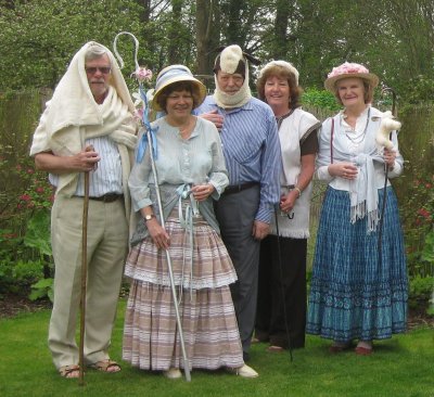 Four shepherds with one sheep between them