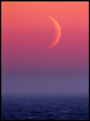 New moon and fog on the ocean just after sunset outside my house at Grönhögen
