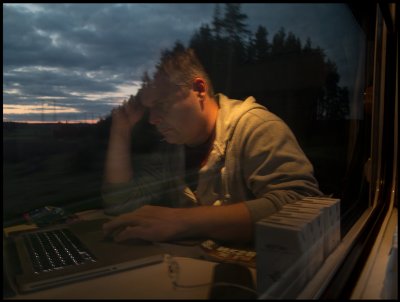 My friend Henrik doing computer work at the night train to northern Sweden