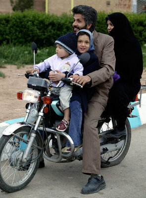 Family on motorcykle - a common sight in Iran