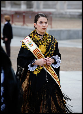 Woman in easter procession on Calle de Bailn outside Palacio real