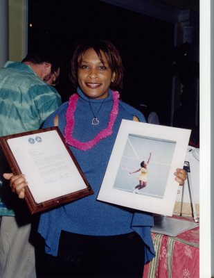 Zina Garrison holding image taken by Gagnon and Collection placque from Hall of Fame