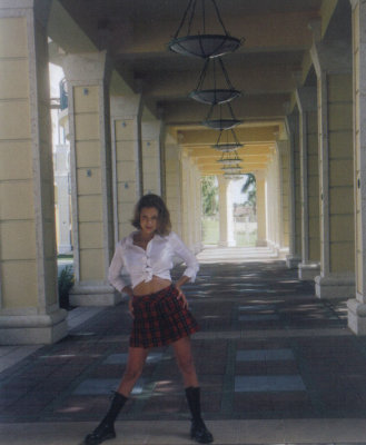 Briana in school girl pose