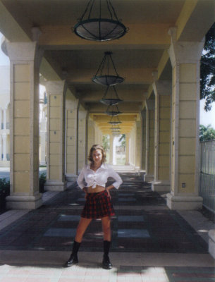 Briana in school girl pose