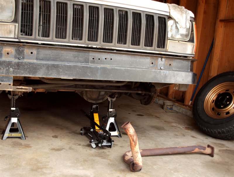 Today I Got The Exhaust Pipe Off...Cleaned And Painted The Front Wheels...