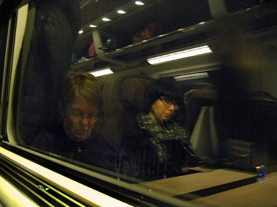Reflection of Margaret and fellow passenger in train window enroute to Rome ..  1345