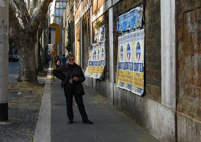 Margaret on via Milano with political posters .. 1381