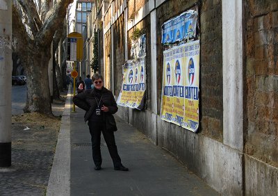 Margaret on via Milano with political posters  .. 1381