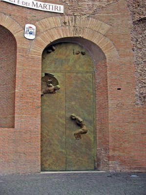 La Basilica di Santa Maria degli Angeli e dei Martiri, portal, angel and martyrs sculpture on door .. 3312