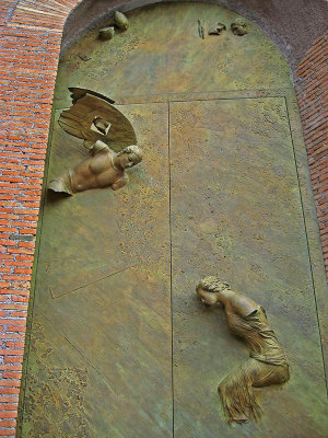 La Basilica di Santa Maria degli Angeli e dei Martiri, portal, angel and martyrs sculpture on door, closeup .. 3315