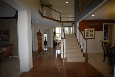 Grand Entry,  Bridge Staircase with Oak Banister