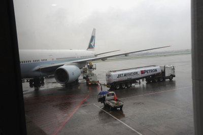 Our plane being refueled...its raining today.