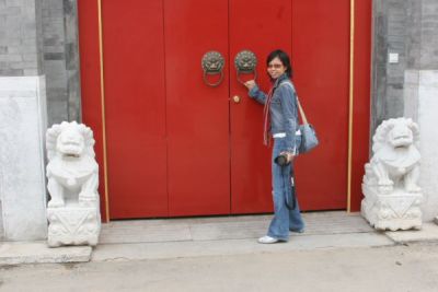 Joyce at a door in Hutong area