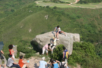 Lisa ancending the Rock at Tin Ha Shan (Anson and Eric Helping)