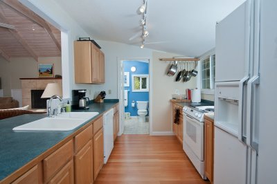 Kitchen with bathroom door open