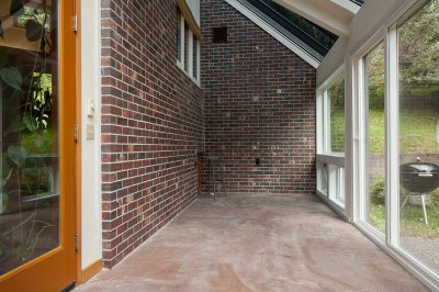 Sun room with heat absorbing brick wall