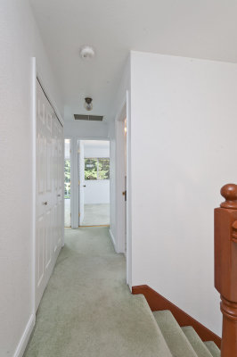 Hallway to the bedrooms and upstairs bath