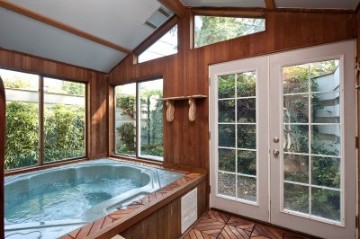 Hottub is adjacent to the master bedroom