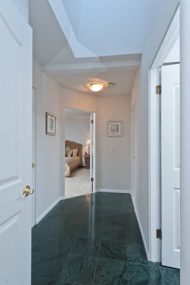 Hallway to master bedroom, bedroom 2 and bath