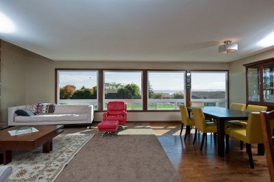 Great room with living area to the left and dining to the right
