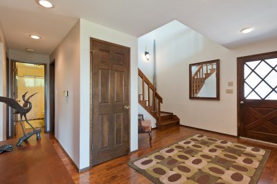 Looking back at the main entry, stairs and lower bath on the left