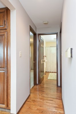 Hallway to the bedroom on the left, bath straight ahead and utility room to the right