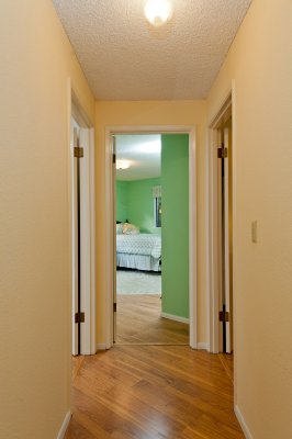 Hallway to bathroom and bedrooms