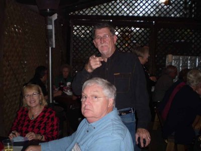 Ronnie Bradshaw (standing), his wife Vicki and Bill Russell (Sandra Humphries Russell's husband) (LKG)