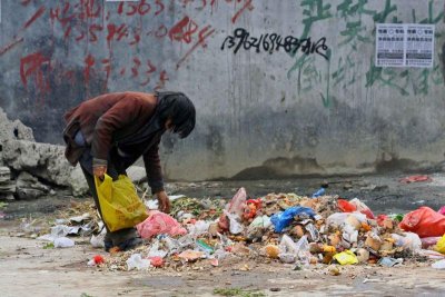 China digging through garbage.jpg