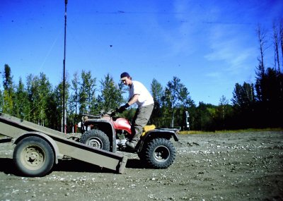 DARREN  UNLOADING THE QUAD.JPG