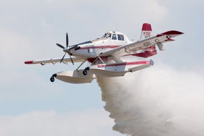 Fire fighting plane releasing water