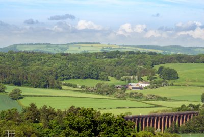Railway viaduct; Wall Hills iron age fort behind eponymous farm at centre